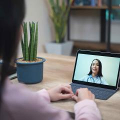 A woman having a telehealth consultation with her GP during the COVID-19 pandemic.