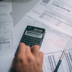 A person calculating finances