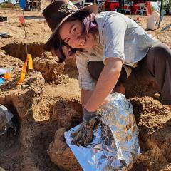 Nellie Pease at a fossil site in Western Queensland