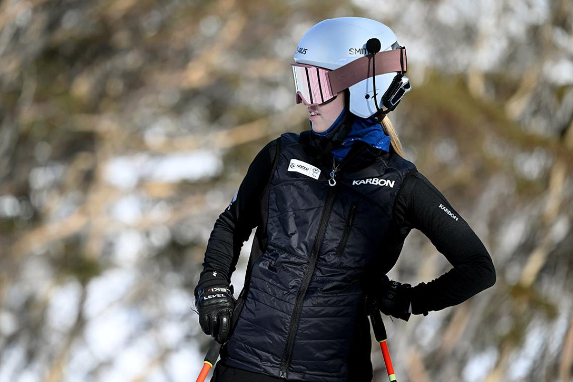 A girl skiing down a slope